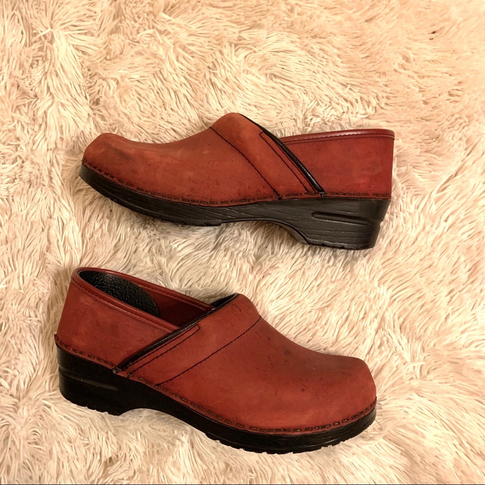 Red nubuck Dansko clogs, gently used condition.